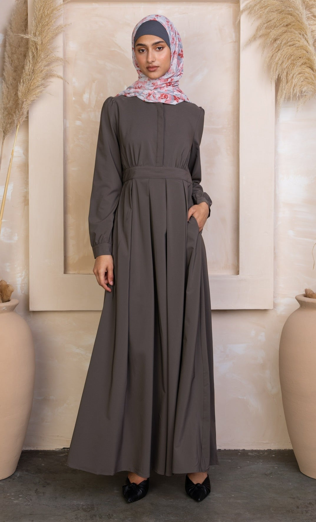 Woman wearing a long-sleeved gray Gray Lattice Abaya Maxi Dress with a floral hijab