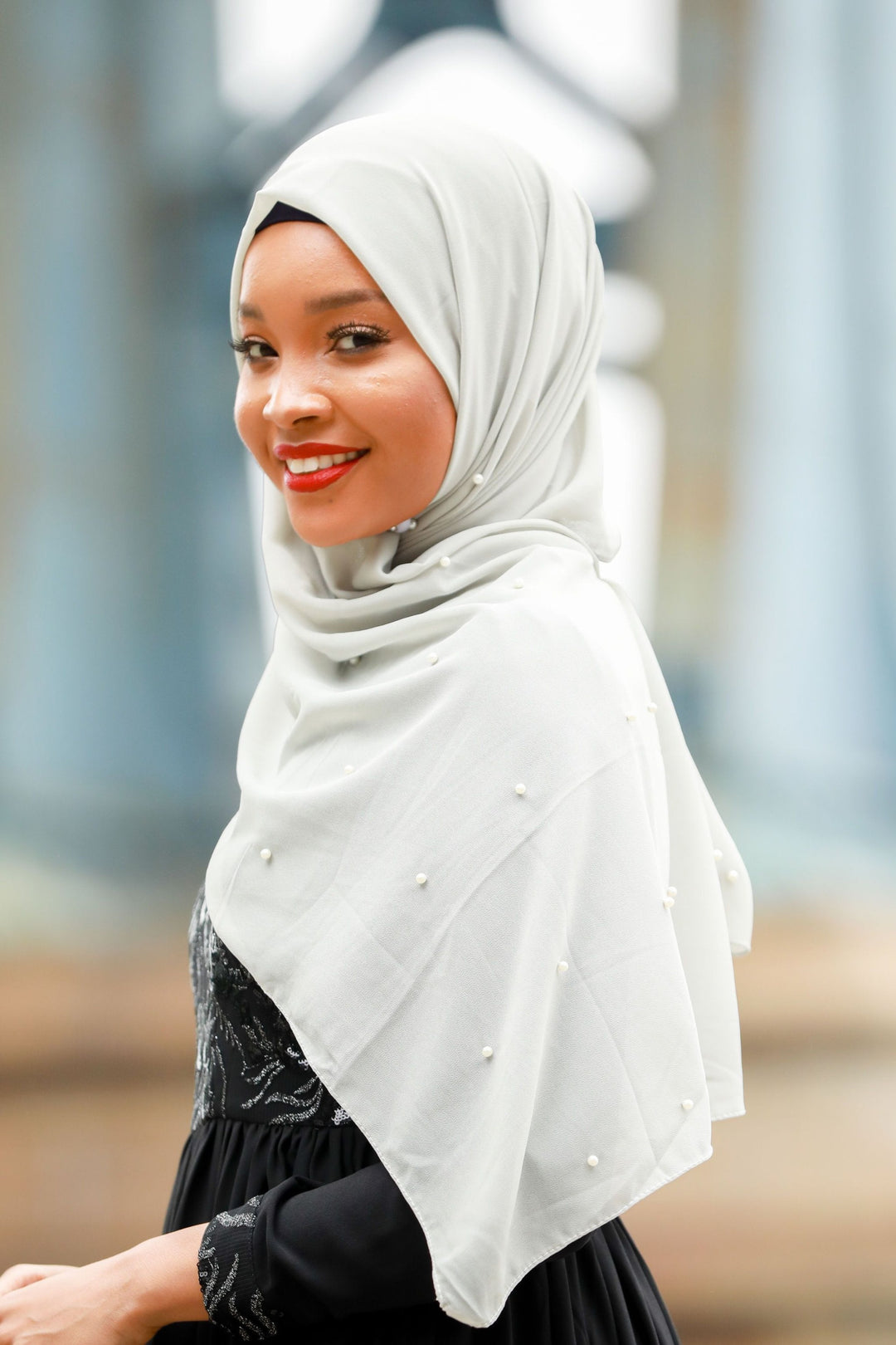 Woman modeling a Gray Pearl Chiffon Hijab with elegant pearl embellishments