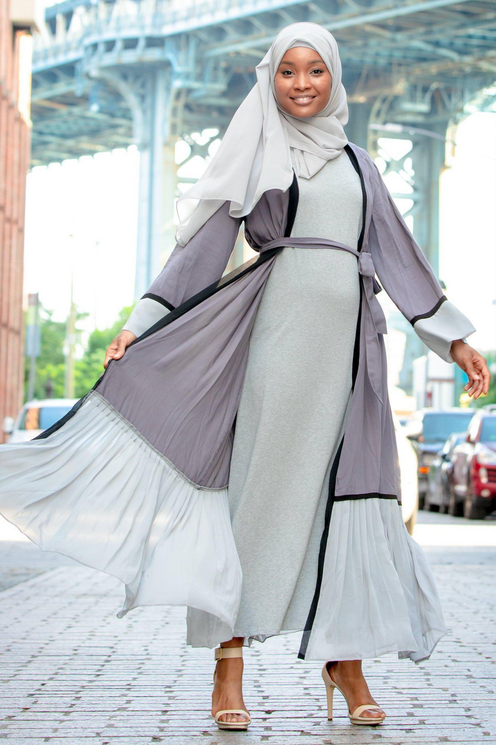 Woman in Gray Ruffle Open Front Abaya showcasing stylish modest fashion on clearance