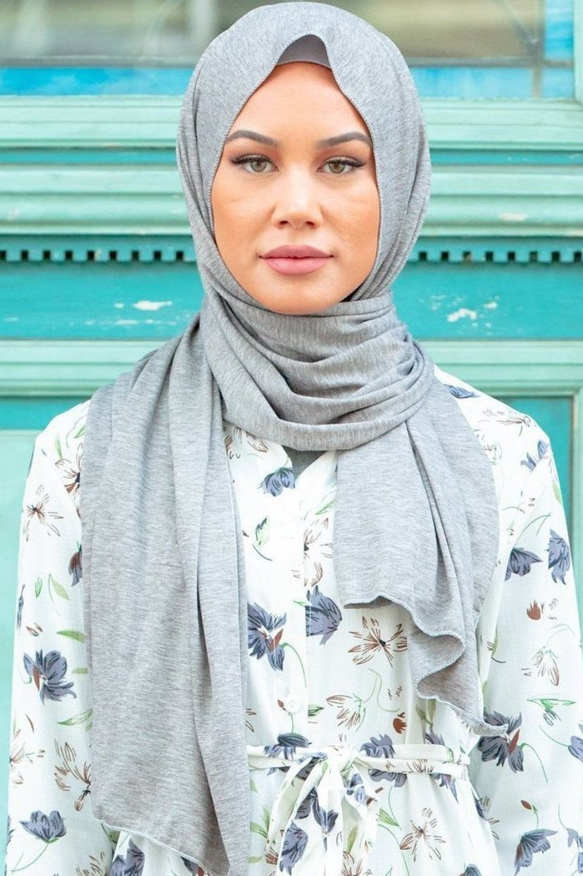 Woman in Heather Grey Jersey Hijab showcasing a stylish gray headscarf look