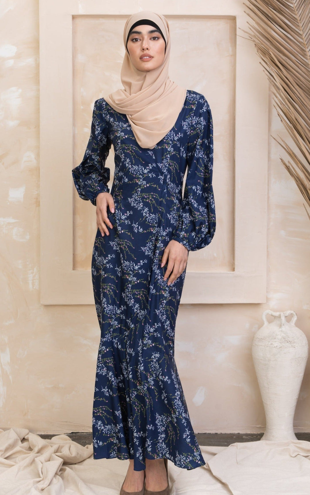 Heavenly Blue Floral Ruffle Faux Wrap Maxi Dress with floral-patterned long sleeves and beige hijab