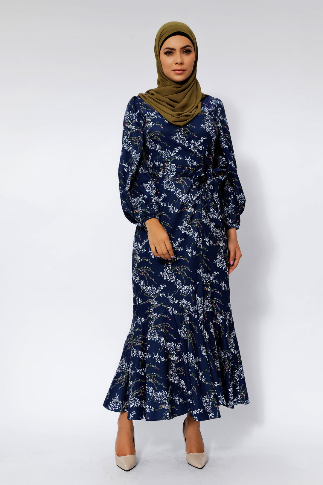 Woman in a hijab wearing a Heavenly Blue Floral Ruffle Faux Wrap Maxi Dress