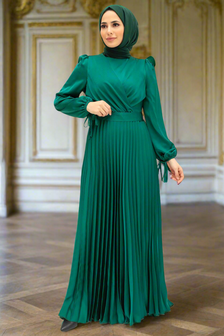 Emerald green criss cross pleated satin gown showcasing elegant design and style