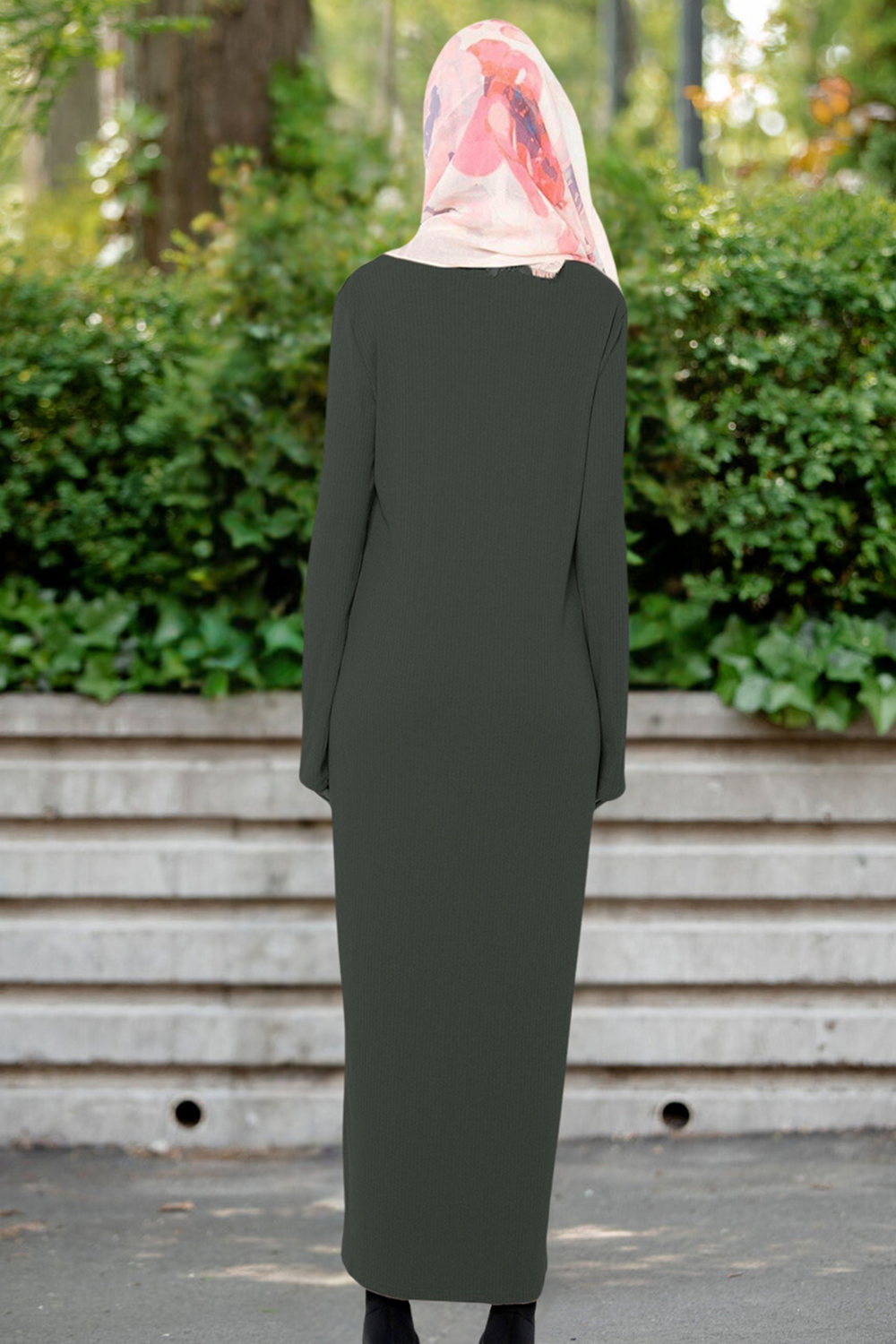 Olive green long-sleeved dress styled with a floral hijab for elegant modest fashion