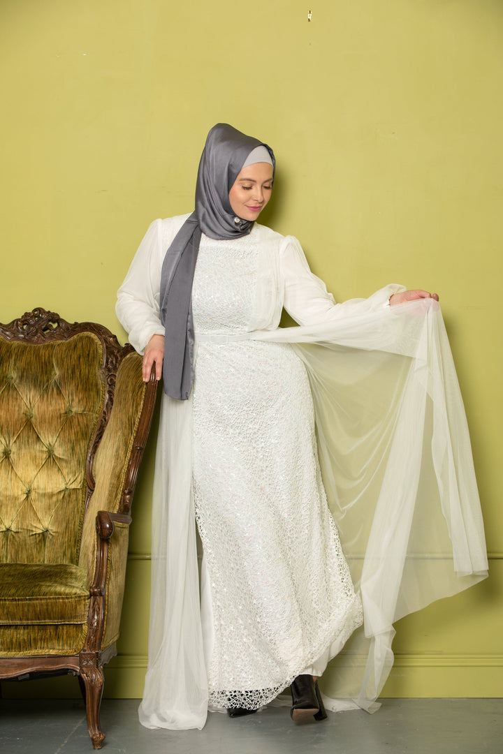 Woman in gray hijab wearing Ivory Lace with Chiffon Overlay Gown