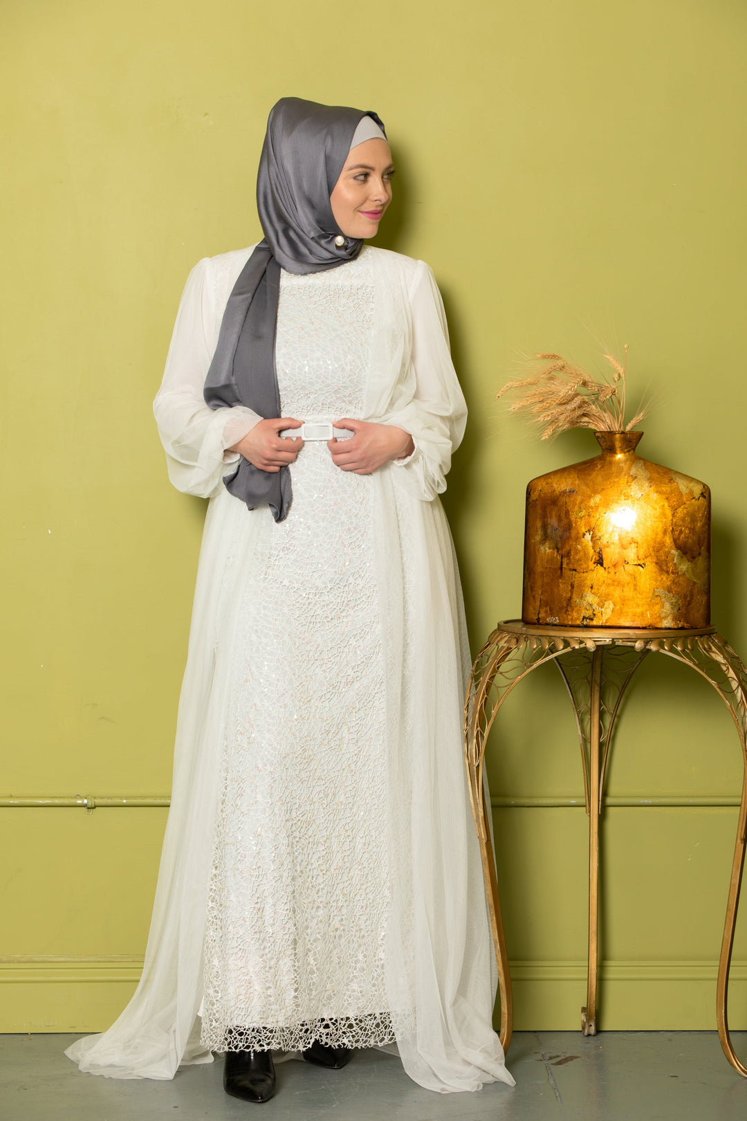 Elegant Ivory Lace with Chiffon Overlay Gown paired with a gray hijab in a modest style