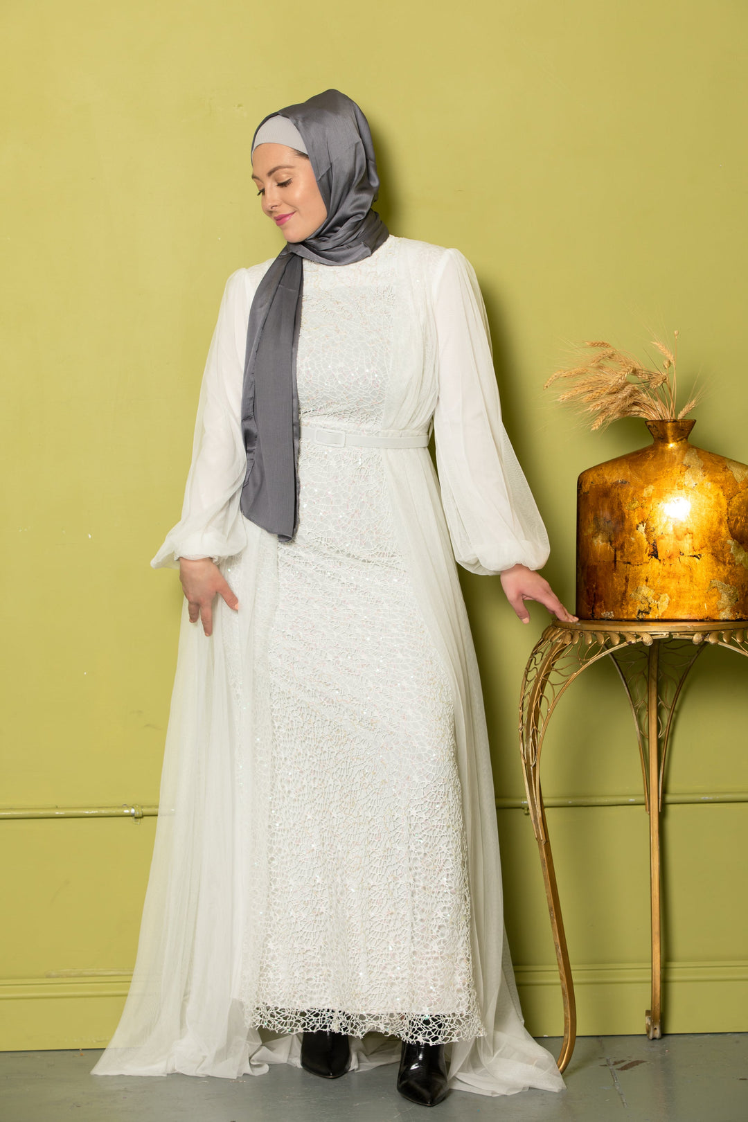 Woman in white dress with gray hijab showcasing Ivory Lace with Chiffon Overlay Gown