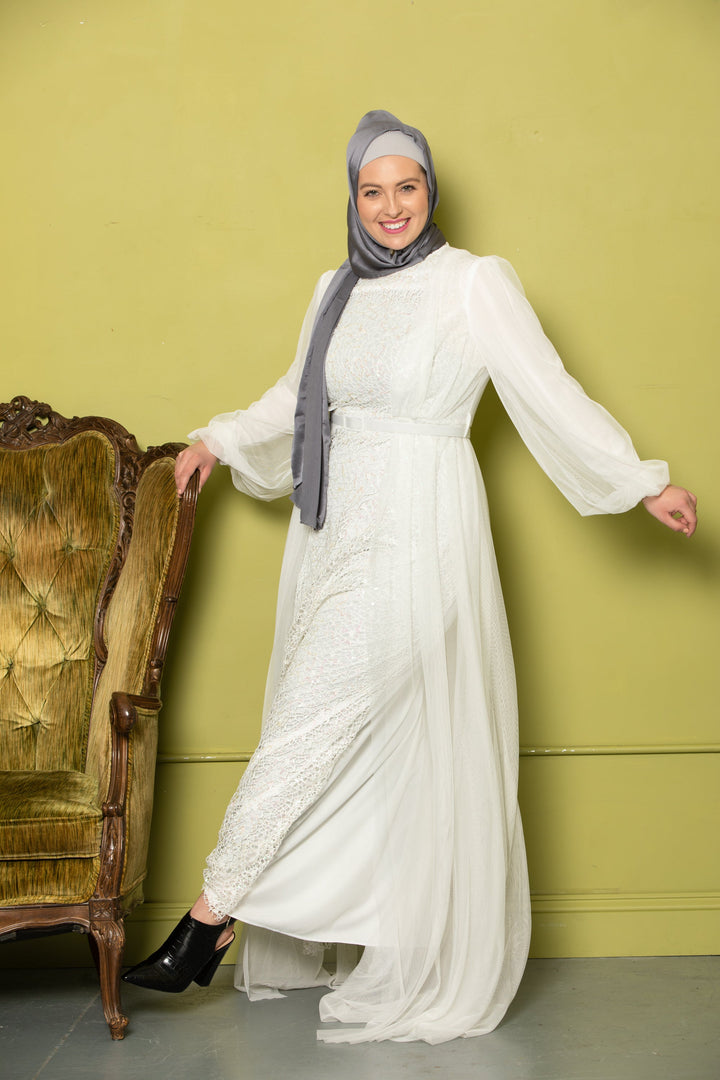 Elegant Ivory Lace with Chiffon Overlay Gown paired with a stylish gray hijab