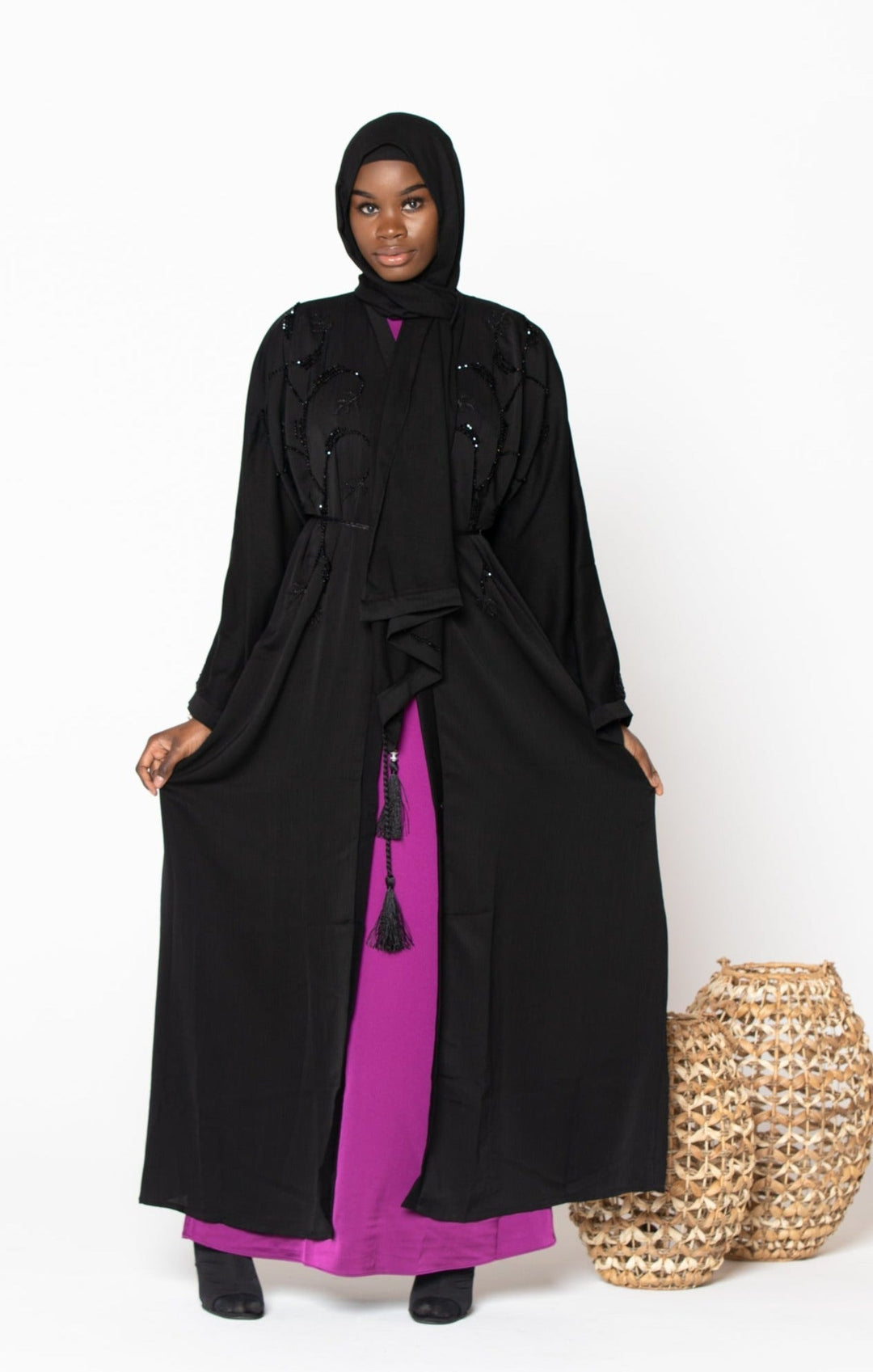 Black Jamilah Sequin Open Front Abaya with a stylish pink dress underneath