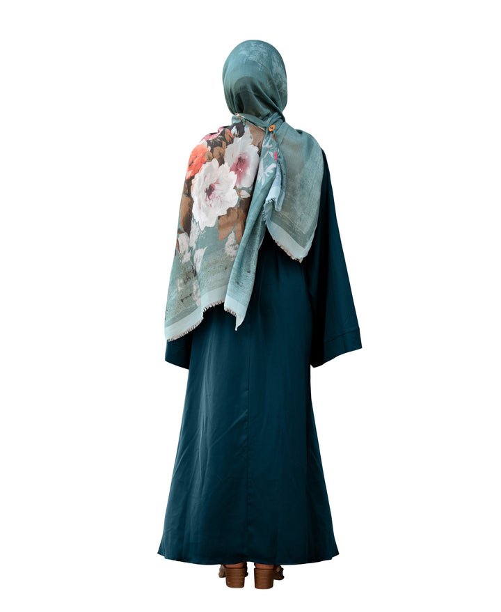 Dark green abaya with floral hijab, featuring kimono sleeves and a fabric tie belt