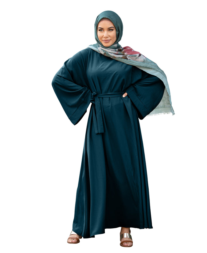 Woman in teal abaya and hijab wearing a Kimono Long Sleeve Maxi Dress with fabric tie belt