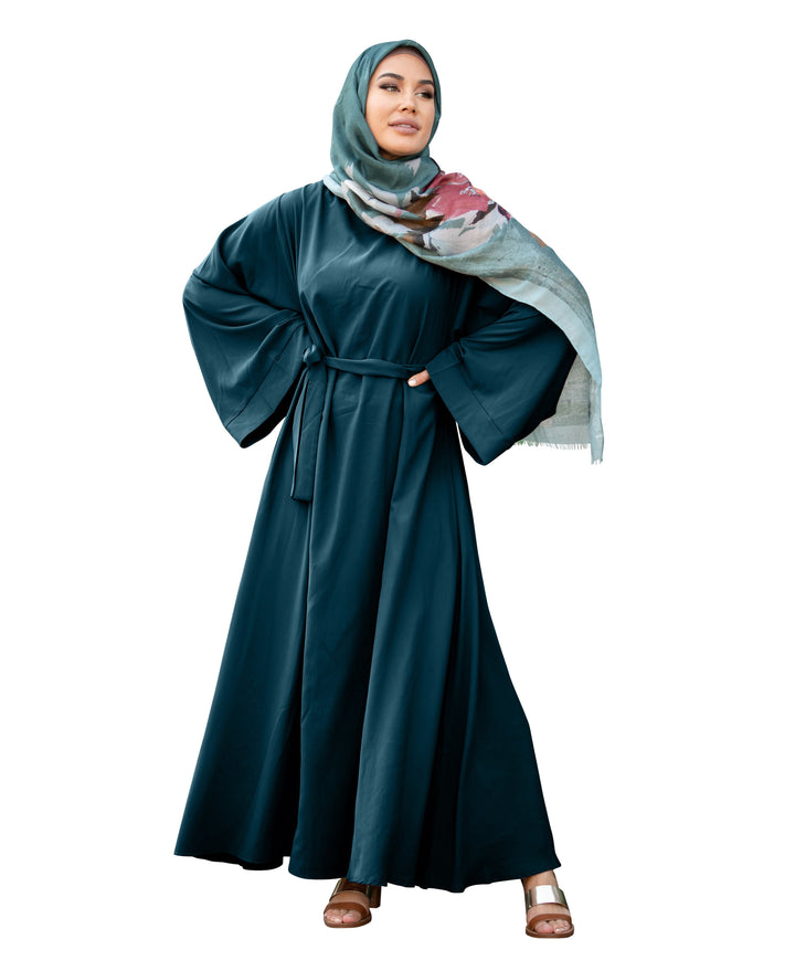 Elegant teal abaya with floral hijab and fabric tie belt in a stylish maxi dress design