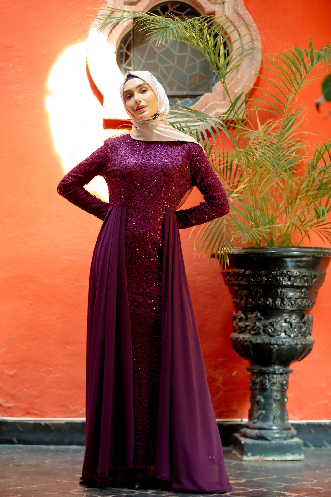 Elegant purple maxi dress with long sleeves and lace skirt overlay, featuring a hijab