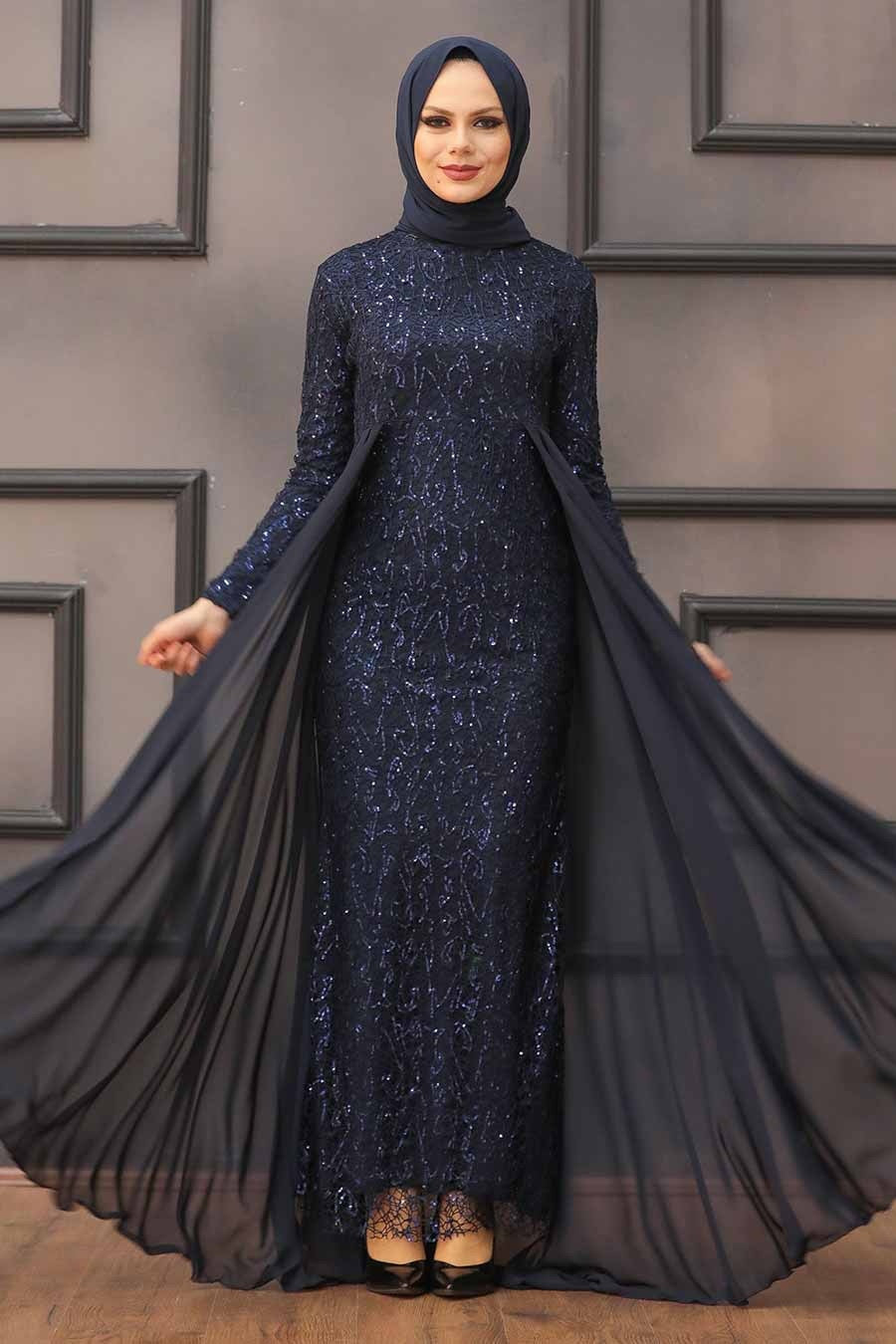 Elegant navy blue sequined maxi dress with attached skirt overlay and chiffon accents