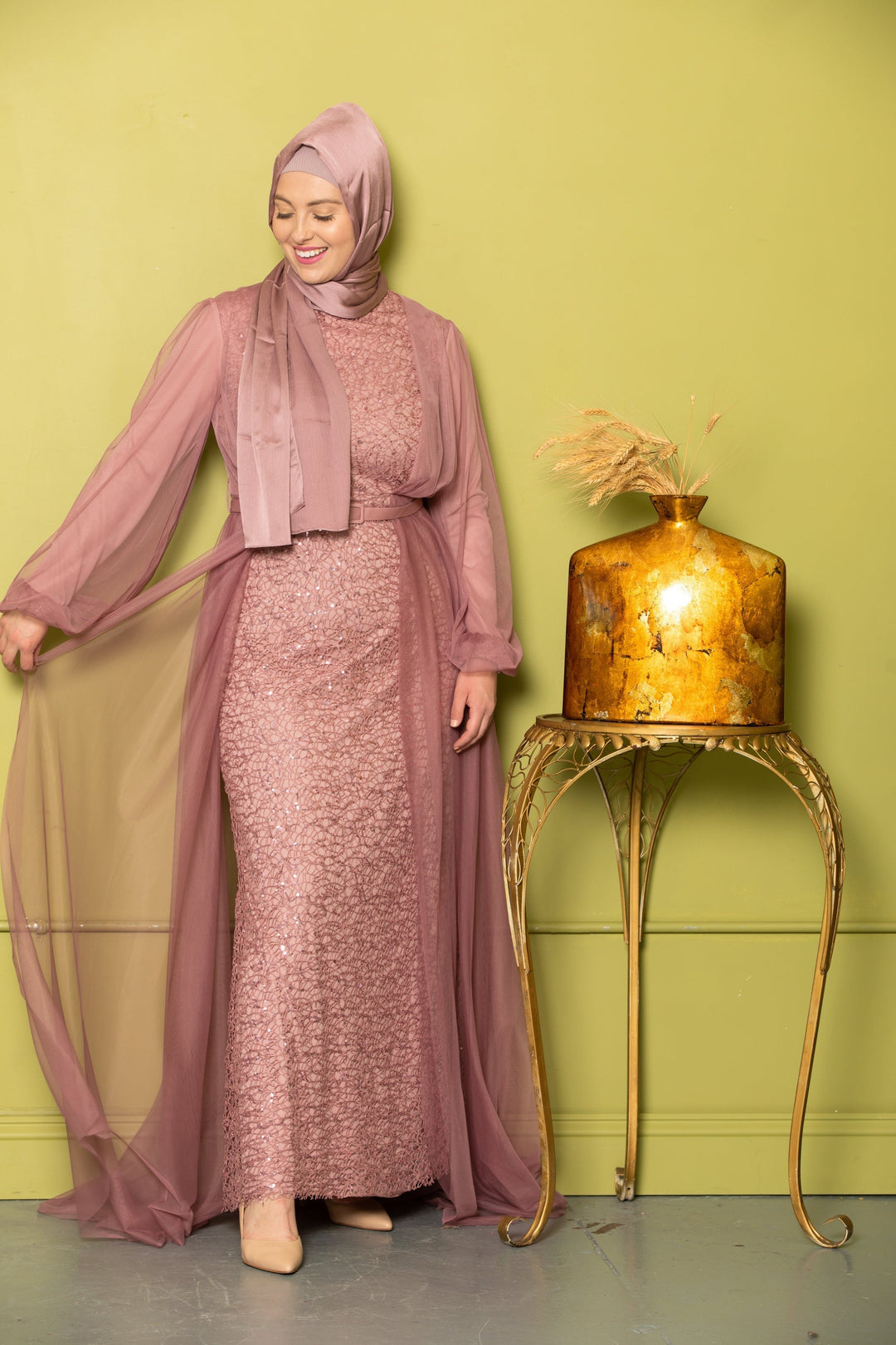 Woman in a mauve dress and hijab wearing a Lace With Chiffon Overlay Gown