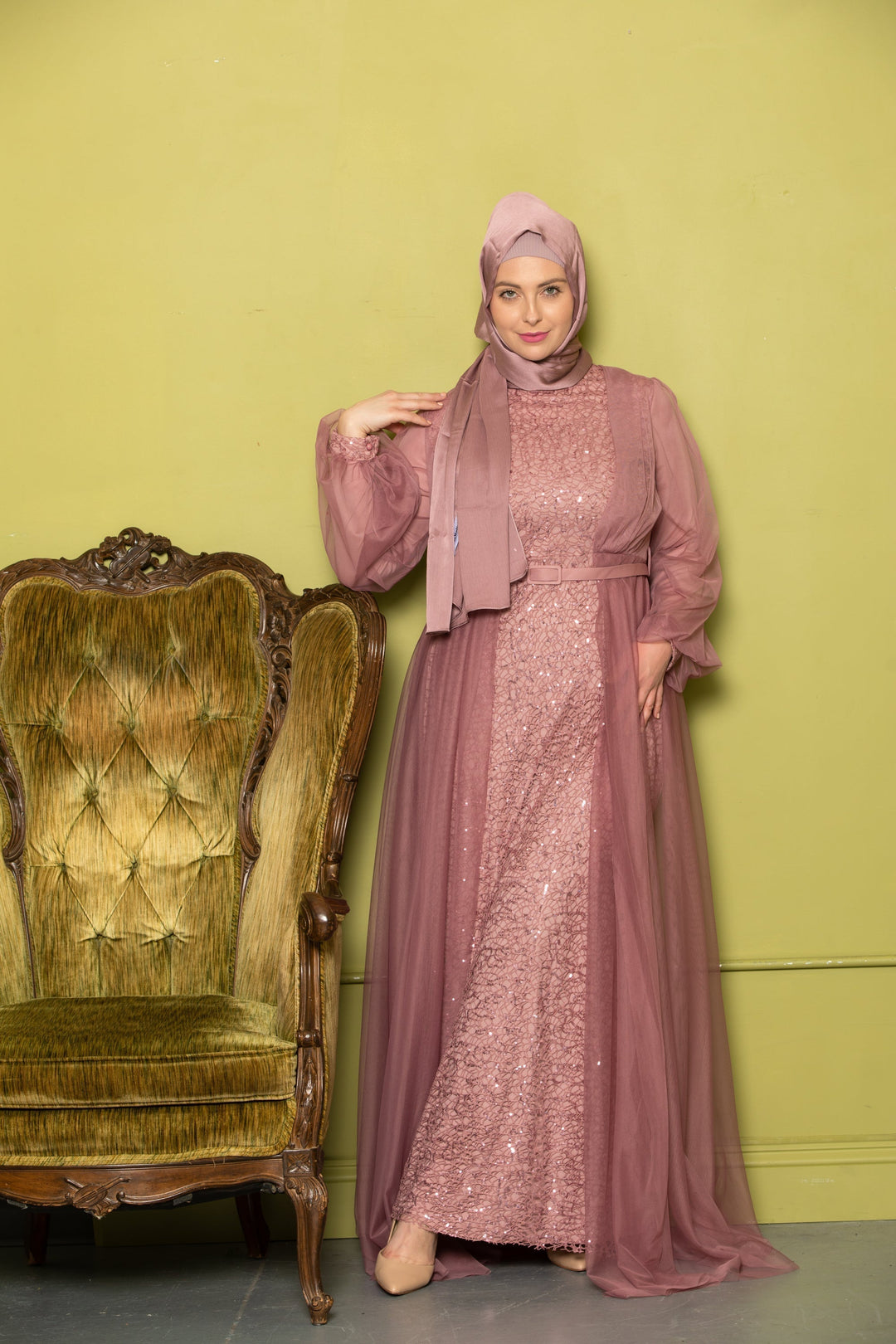 Woman in mauve gown and hijab showcasing a beautiful Lace With Chiffon Overlay Gown