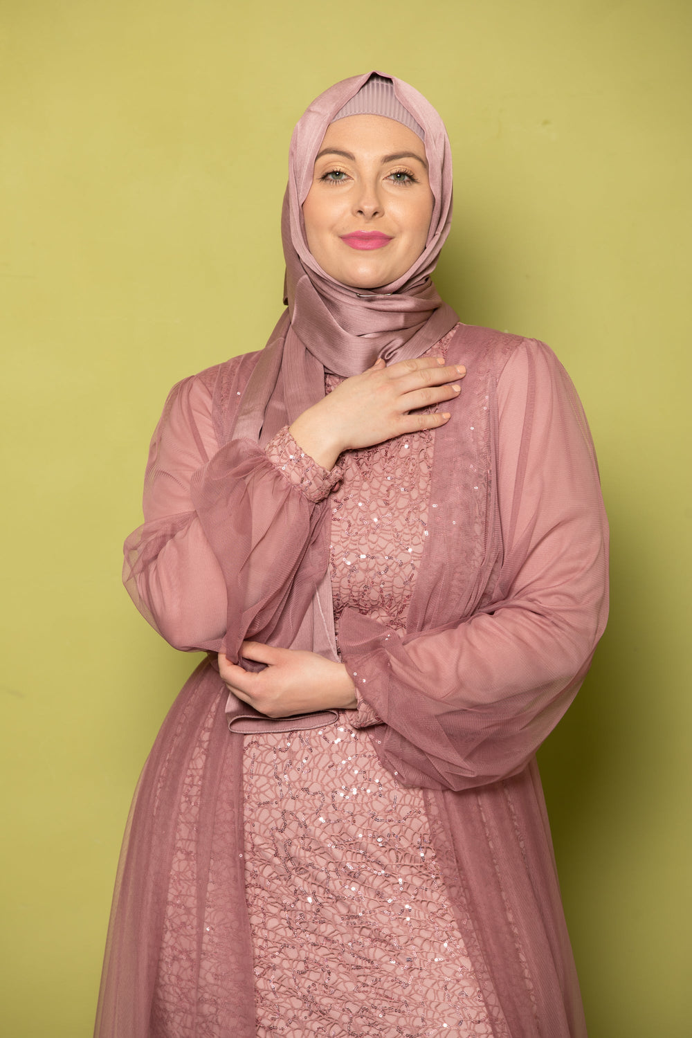 Woman in a mauve hijab and dress wearing Lace With Chiffon Overlay Gown