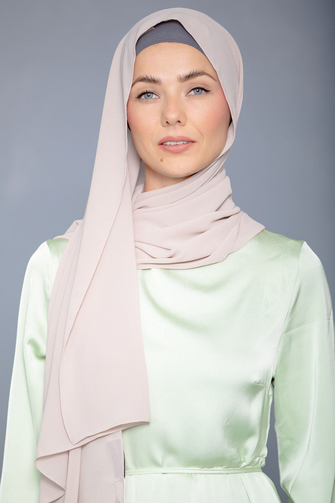 Woman in a Latte Chiffon Hijab and light green maxi dress, exuding elegance