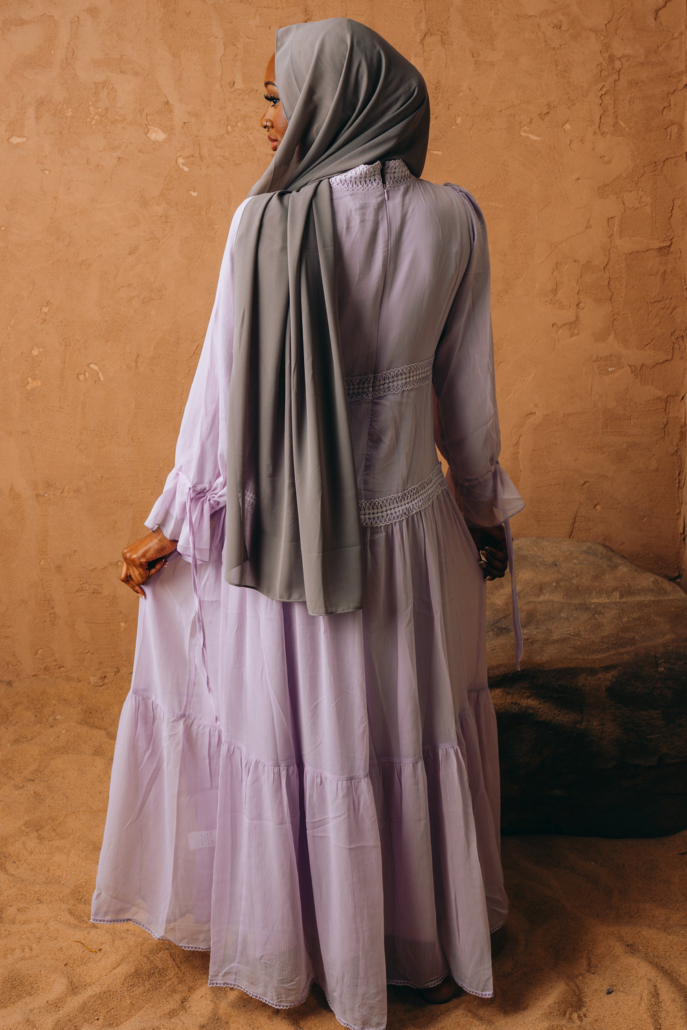 Lavender Lace Empire Waist Tiered Maxi Dress paired with a gray hijab for chic style