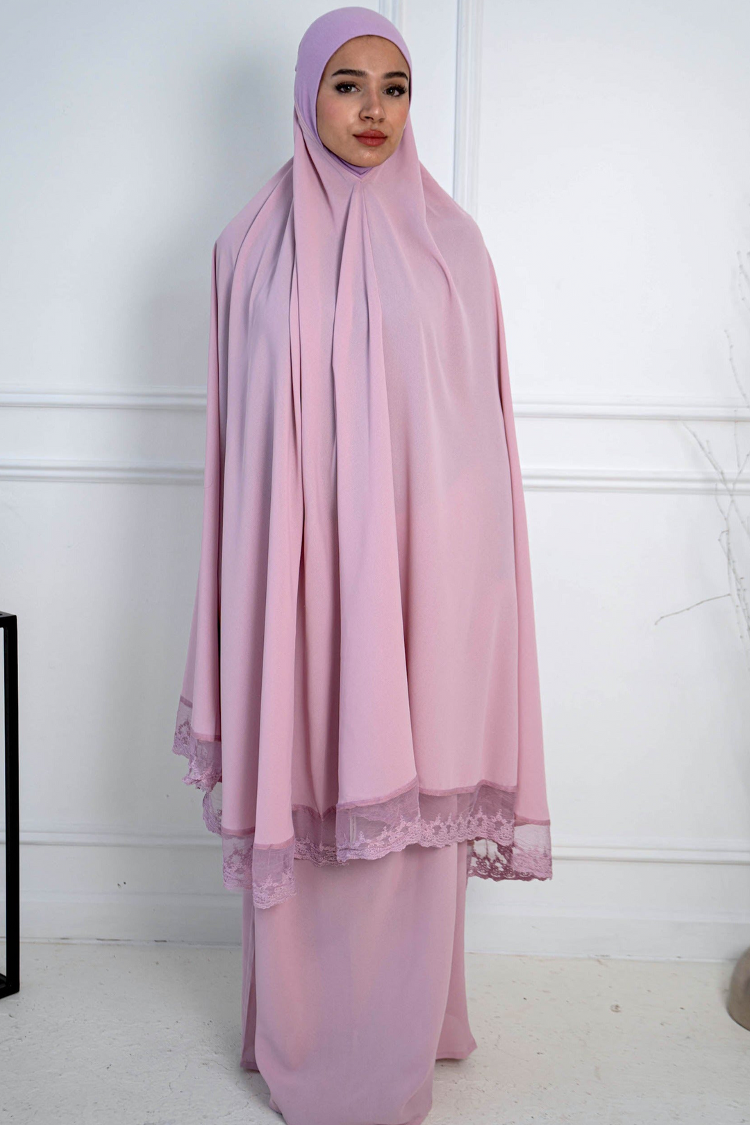 Woman in a pink prayer garment showcasing the Lavender Lace Two Piece Salah Prayer Outfit