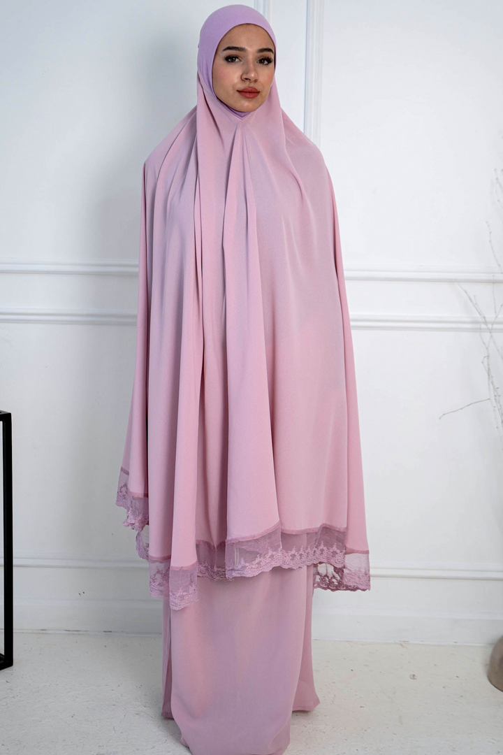 Woman in a pink prayer garment showcasing the Lavender Lace Two Piece Salah Prayer Outfit