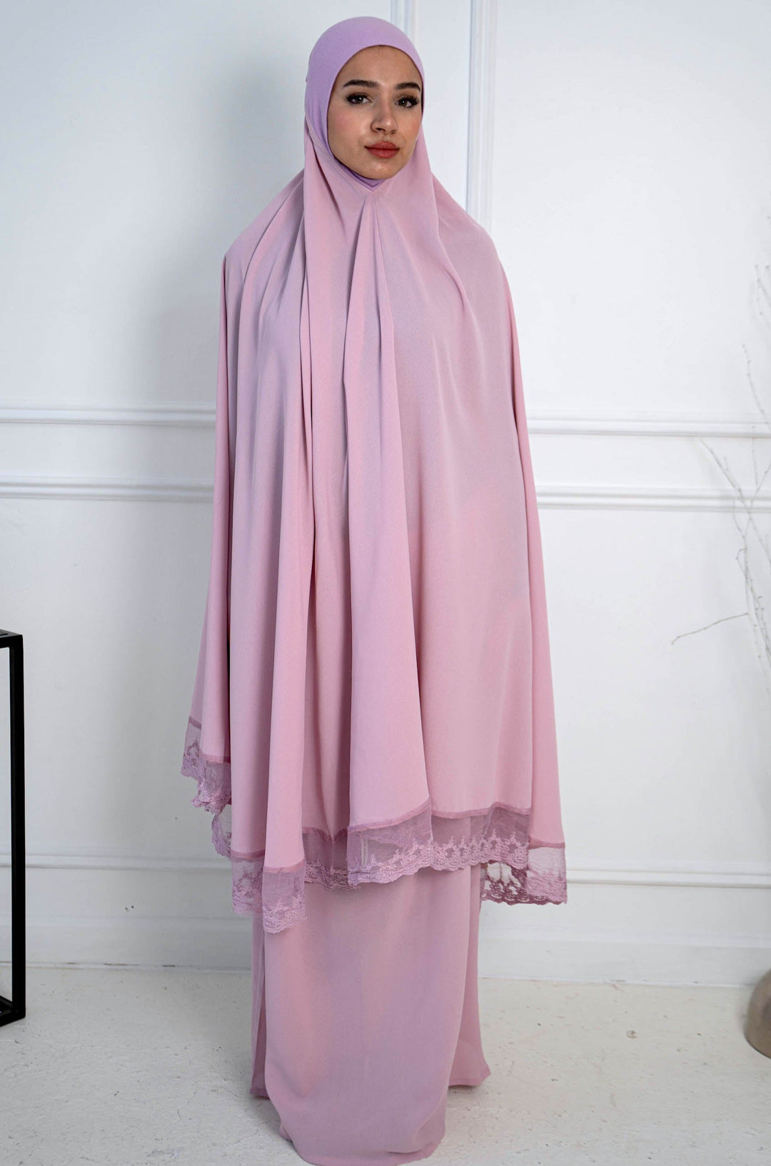 Woman in a pink prayer garment wearing the Lavender Lace Two Piece Salah Prayer Outfit