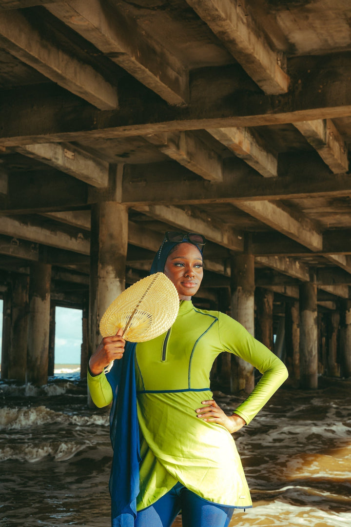 Lime Green 3 Piece Modest Swimsuit displayed with a stylish fan for a chic summer look