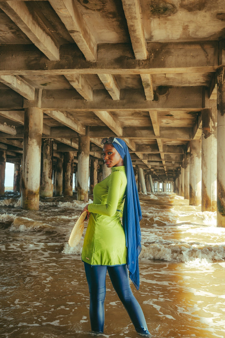 Lime Green 3 Piece Modest Swimsuit displayed under a pier for stylish beachwear