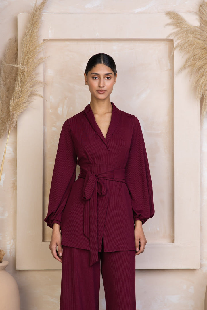 Burgundy wrap-style pantsuit featuring a Maroon Belted Ribbed Tunic & Pants Set