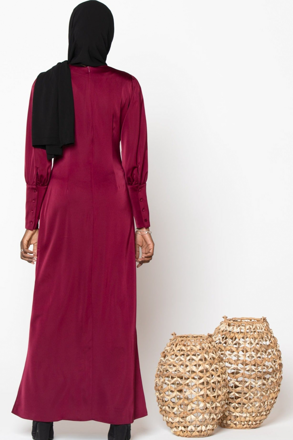 Burgundy satin long sleeve maxi dress showcasing elegant style and luxurious fabric