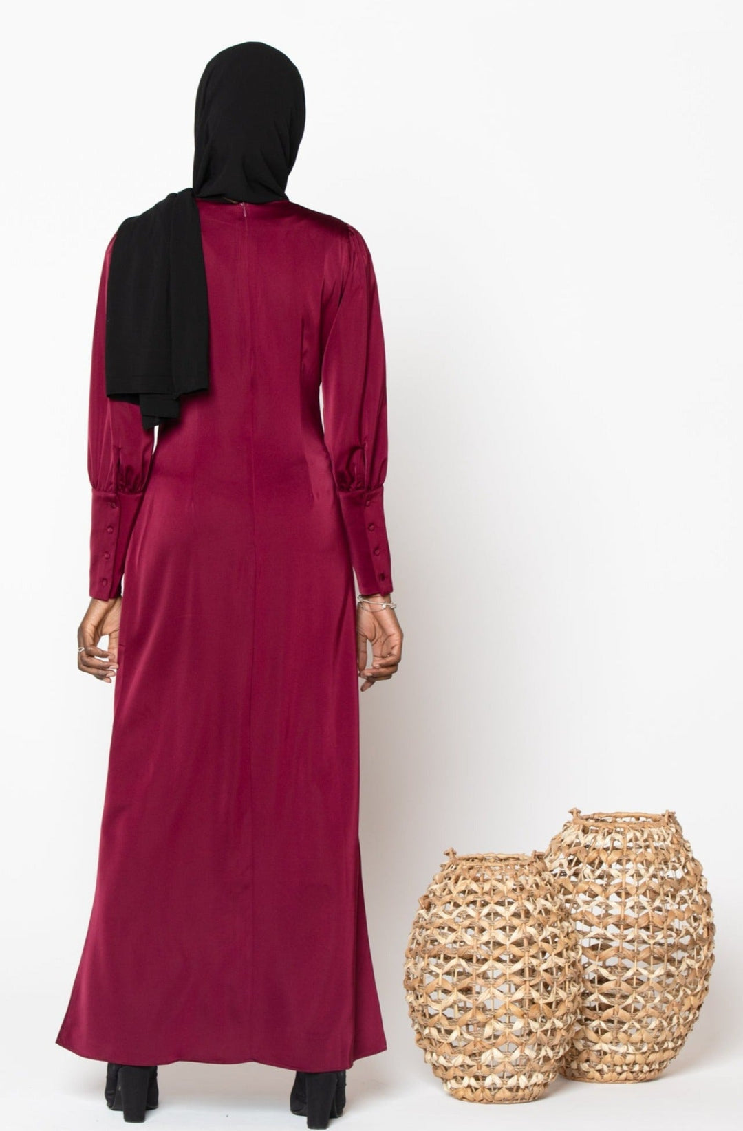 Burgundy satin long sleeve maxi dress paired with a stylish hijab for elegant occasions