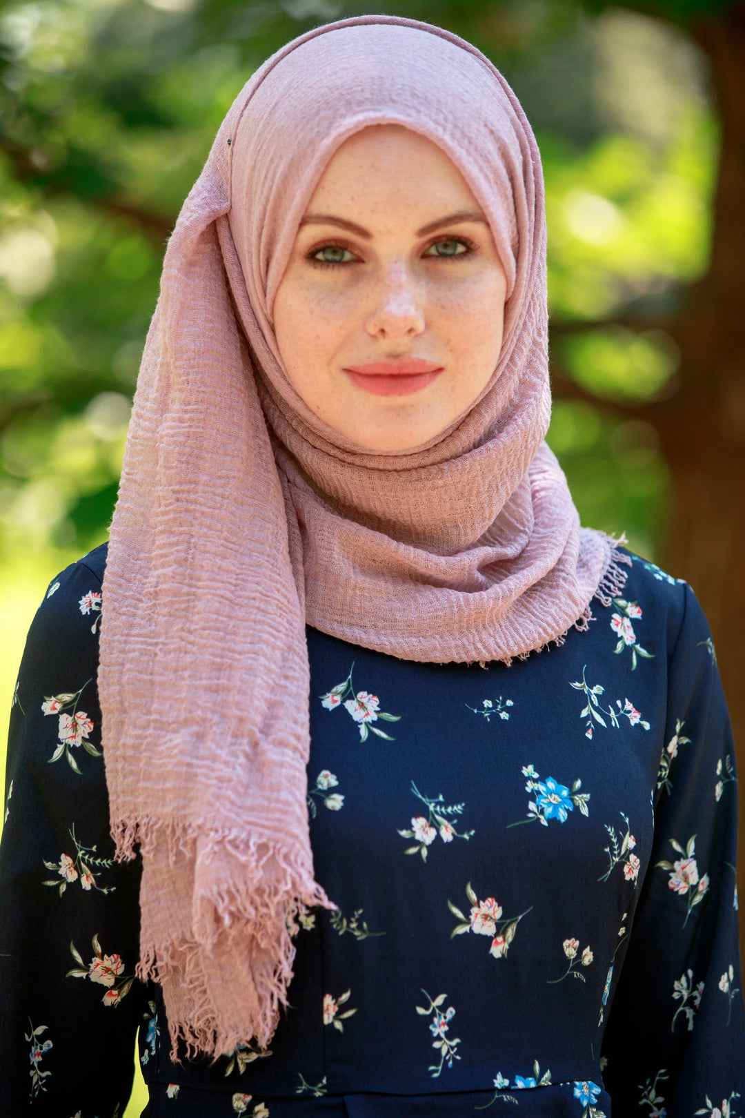 Woman in a pink cotton hijab showcasing the Mauve Cotton Hijab scarf