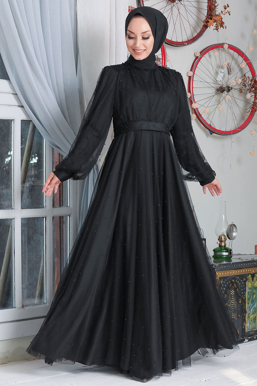 Elegant black tulle dress from the Mesh Pearl Long Sleeve Gown collection