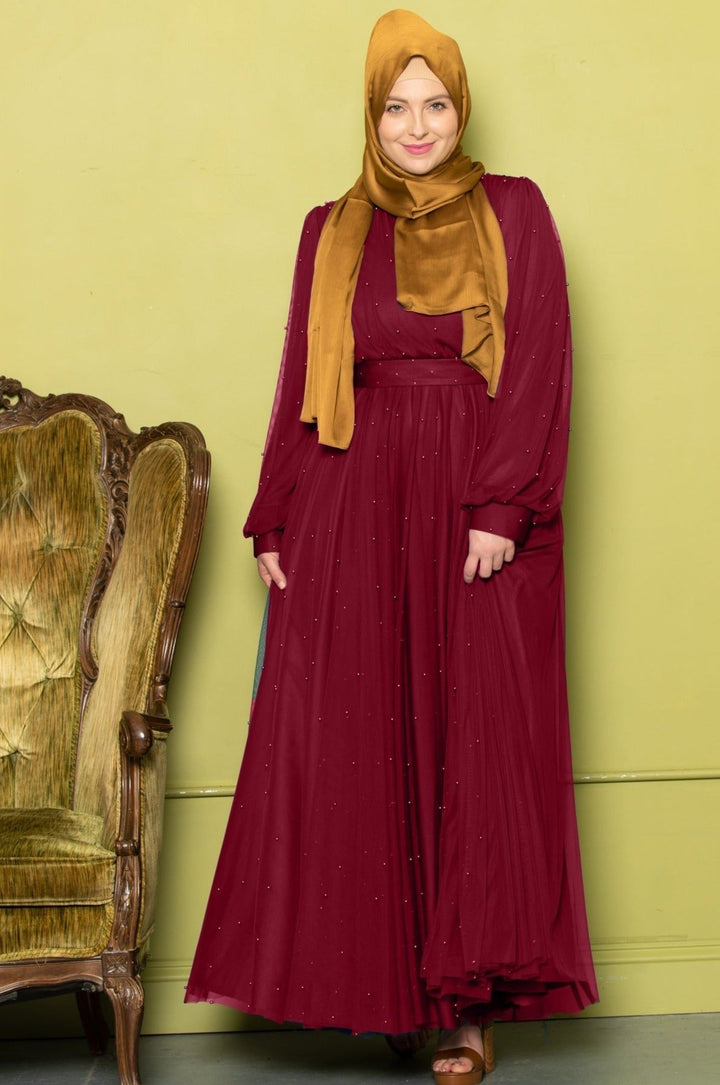 Burgundy beaded chiffon dress with gold hijab from the Mesh Pearl Long Sleeve Gown collection