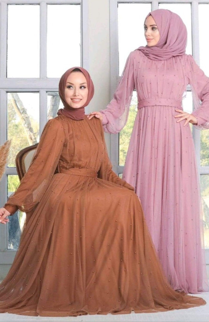 Two women in Pearl Long Sleeve Gowns showcasing elegant mesh designs and hijabs