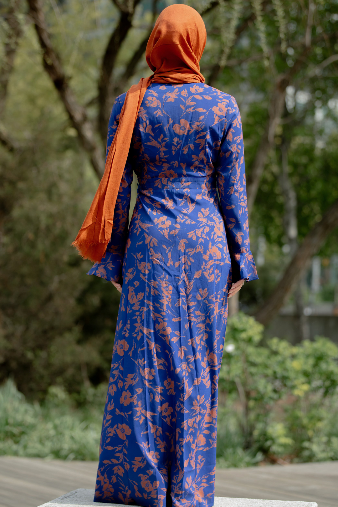 Blue floral dress with orange hijab showcasing a custom printed Caramel Flutter Long Sleeve Maxi Dress