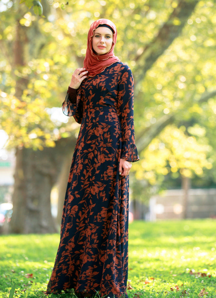 Woman wearing a Navy and Caramel Flutter Long Sleeve Maxi Dress on clearance