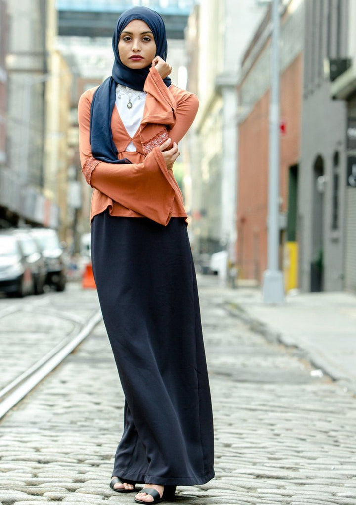 Fashionably dressed woman in hijab wearing Navy Blue Pencil Maxi Skirt on clearance