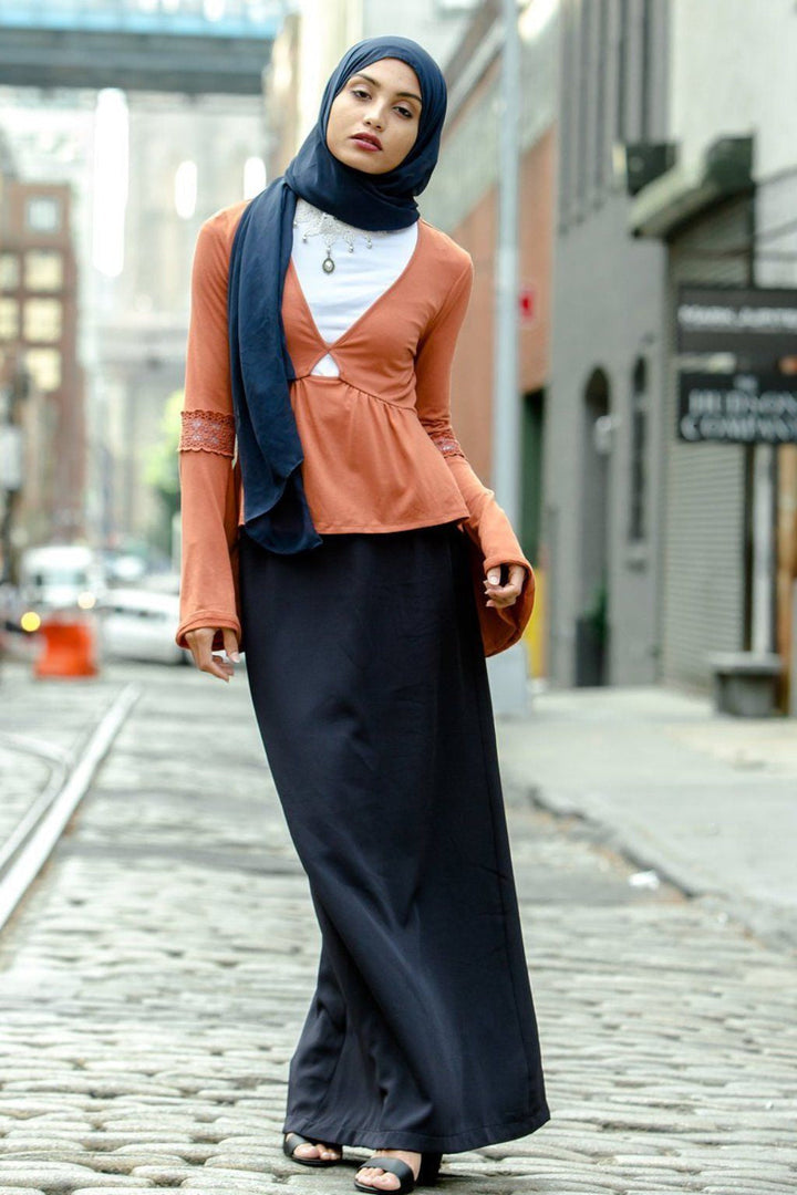 Woman wearing Navy Blue Pencil Maxi Skirt showcasing elegant modest fashion style