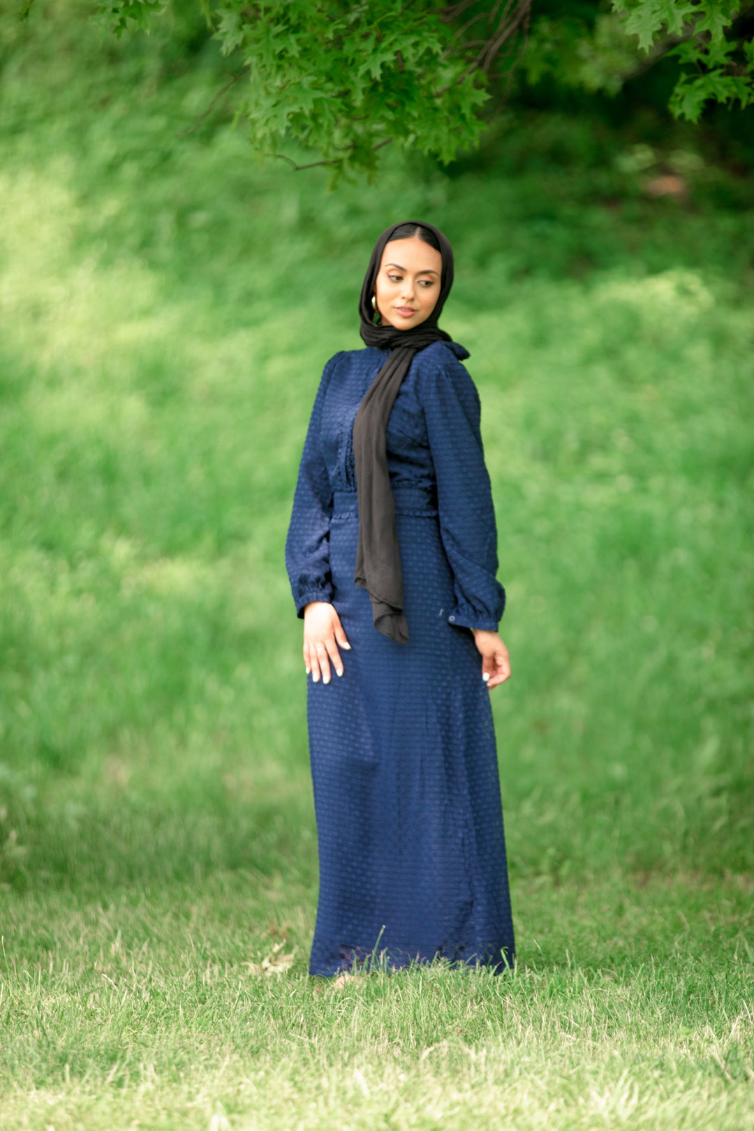 Navy blue textured polka long sleeve maxi dress paired with a black hijab