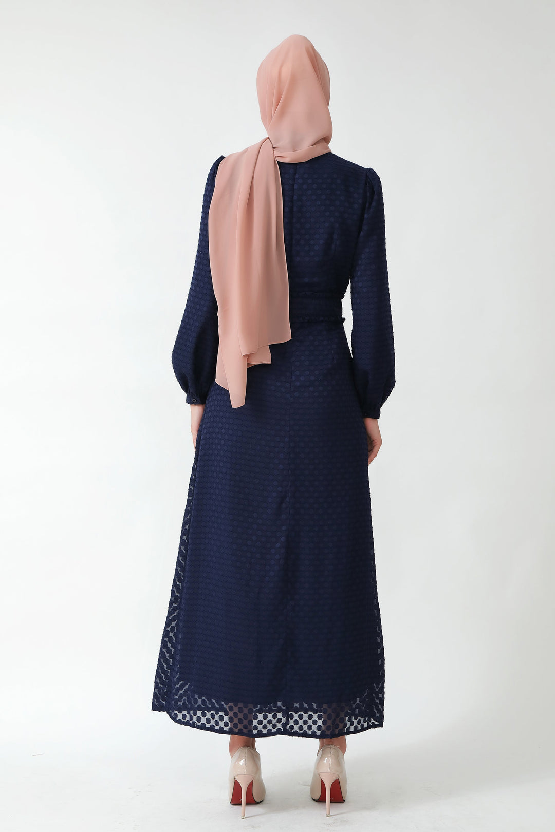 Navy blue textured polka dots long sleeve maxi dress with peach hijab displayed