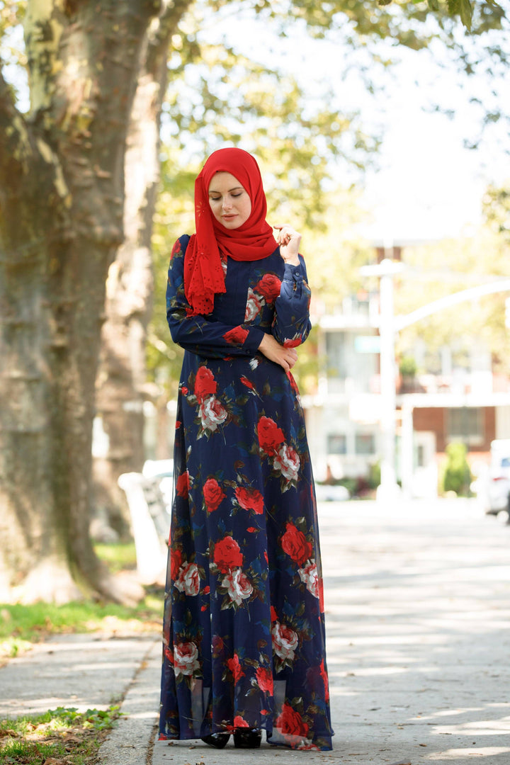 Floral maxi dress with red hijab showcasing urban modesty and stylish modest clothing