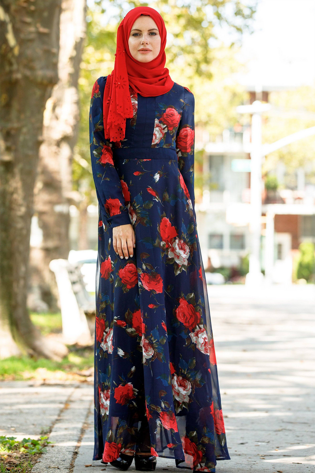 Floral long-sleeved maxi dress for urban modesty paired with a red hijab