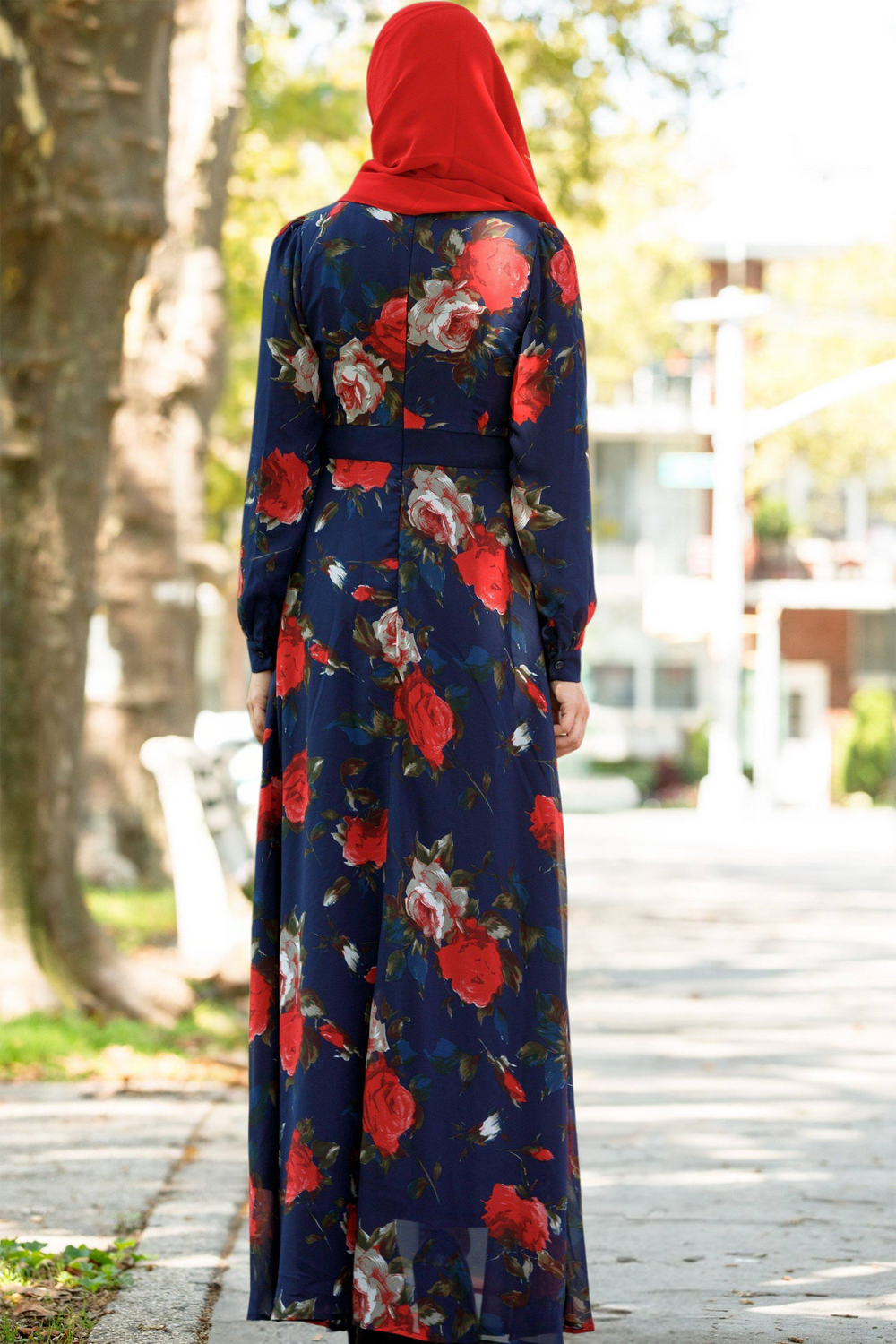 Floral print maxi dress with red hijab showcasing urban modesty in stylish modest clothing