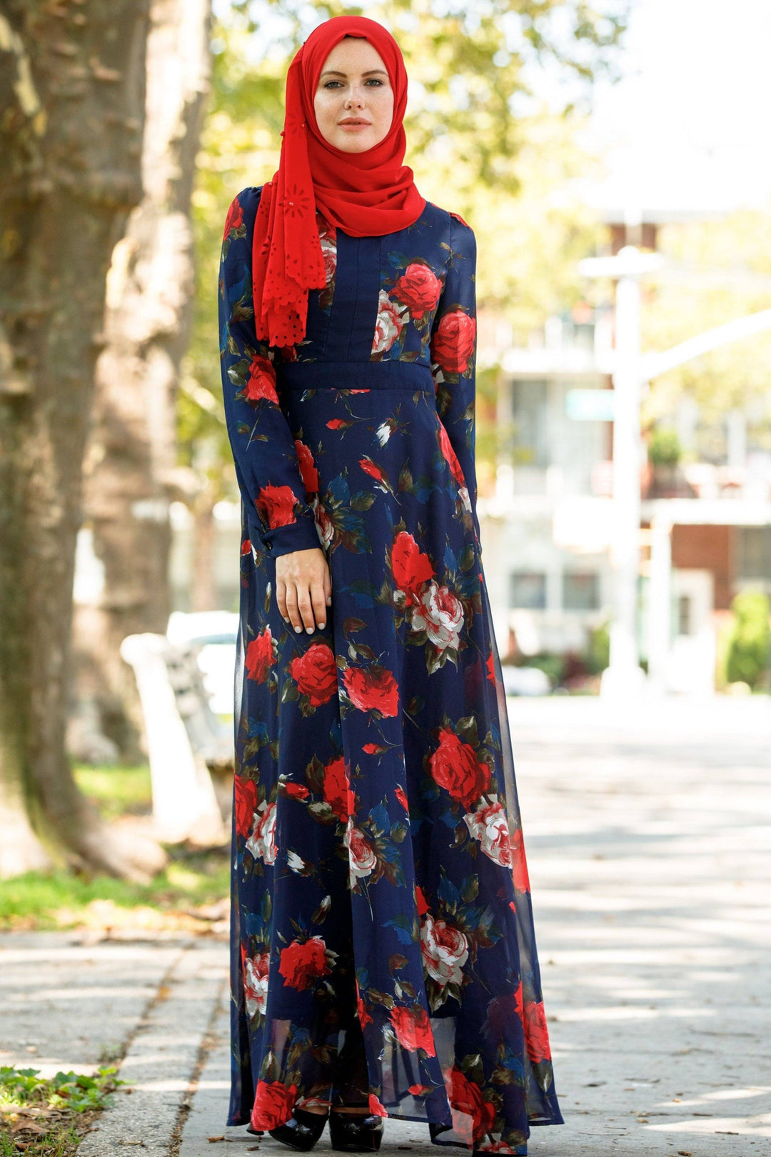 Floral print long-sleeved dress paired with red hijab showcasing urban modesty style