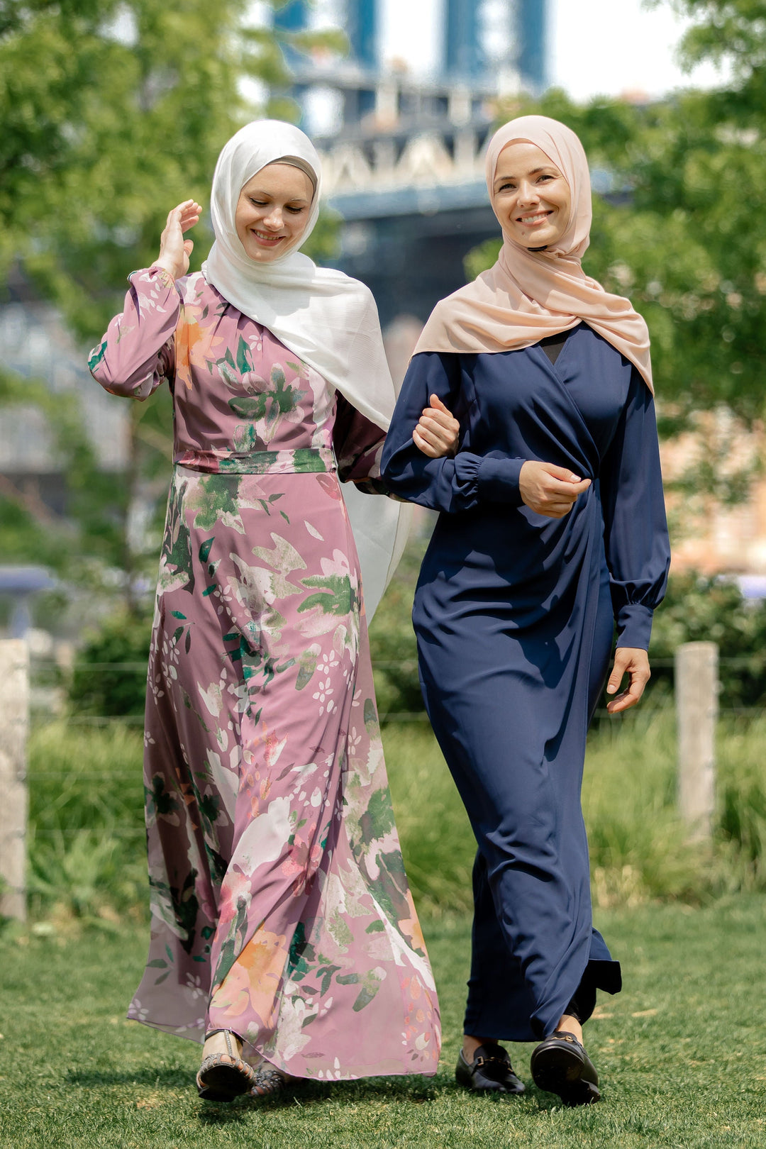 Two women in hijabs wearing Navy Wrap Maxi Dress with criss cross neckline