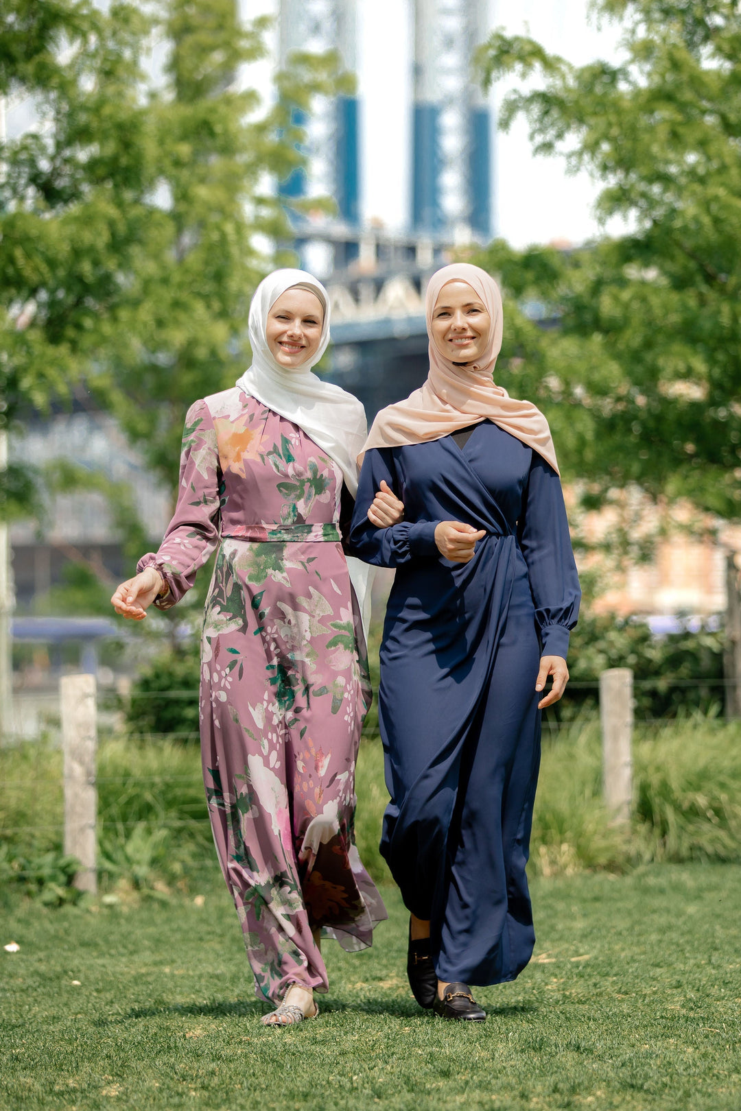 Two women in hijabs wearing a Navy Wrap Maxi Dress with criss cross neckline