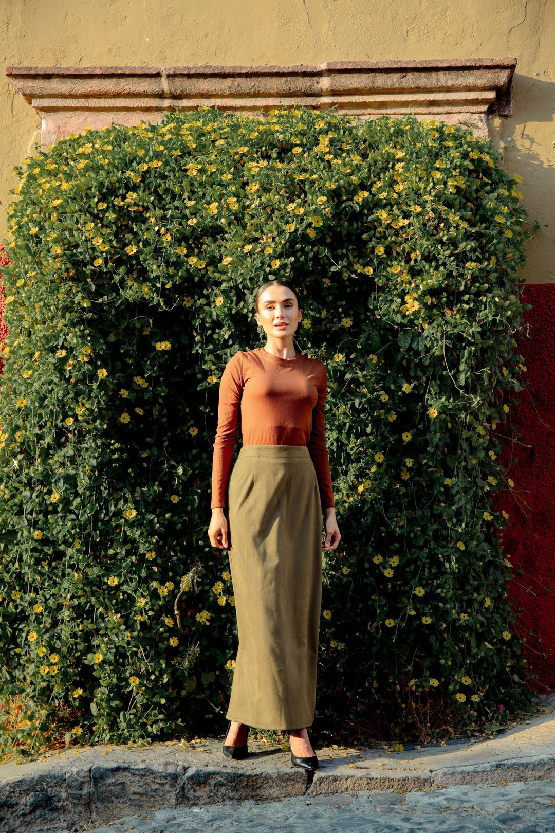 Woman wearing Olive Green Suede Pencil Maxi Skirt showcasing stylish design and fabric