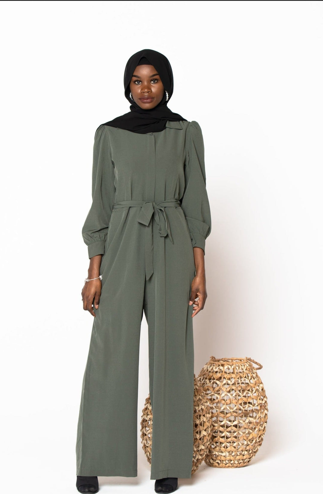 Olive green jumpsuit paired with a black hijab, perfect for stylish modest wear