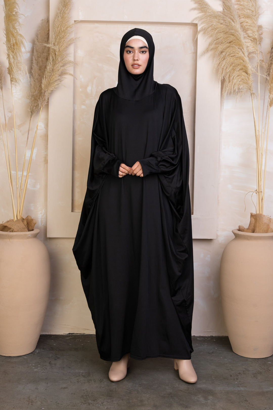 Black loose-fitting abaya with attached hijab in breathable material for a stylish Salah outfit